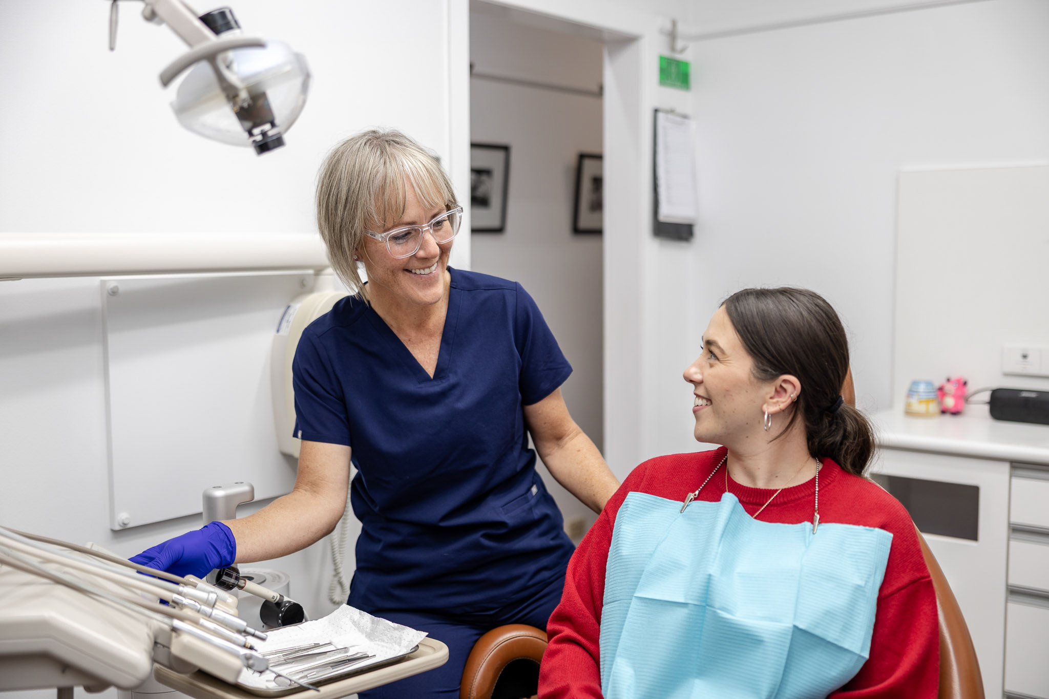Dentist and patient chatting during a check-up