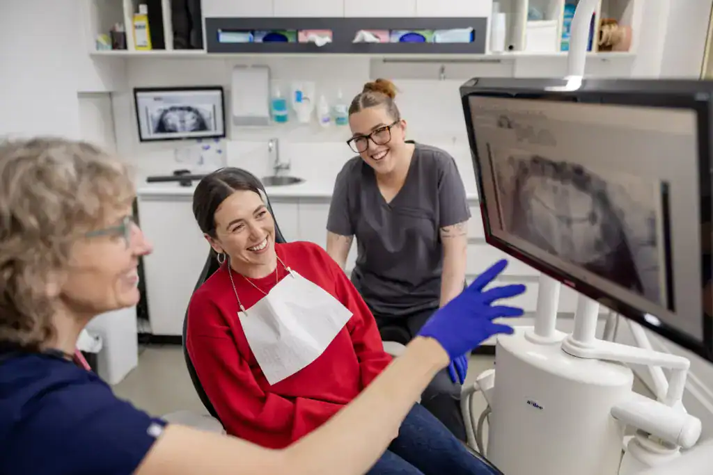 A patient being shown her x-ray on screen