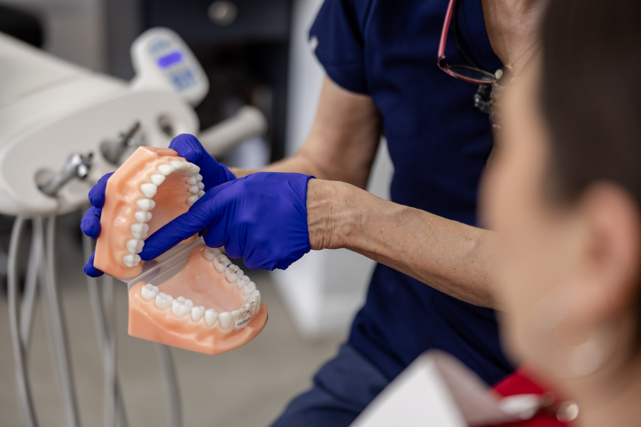 Dentist holding a set of dentures