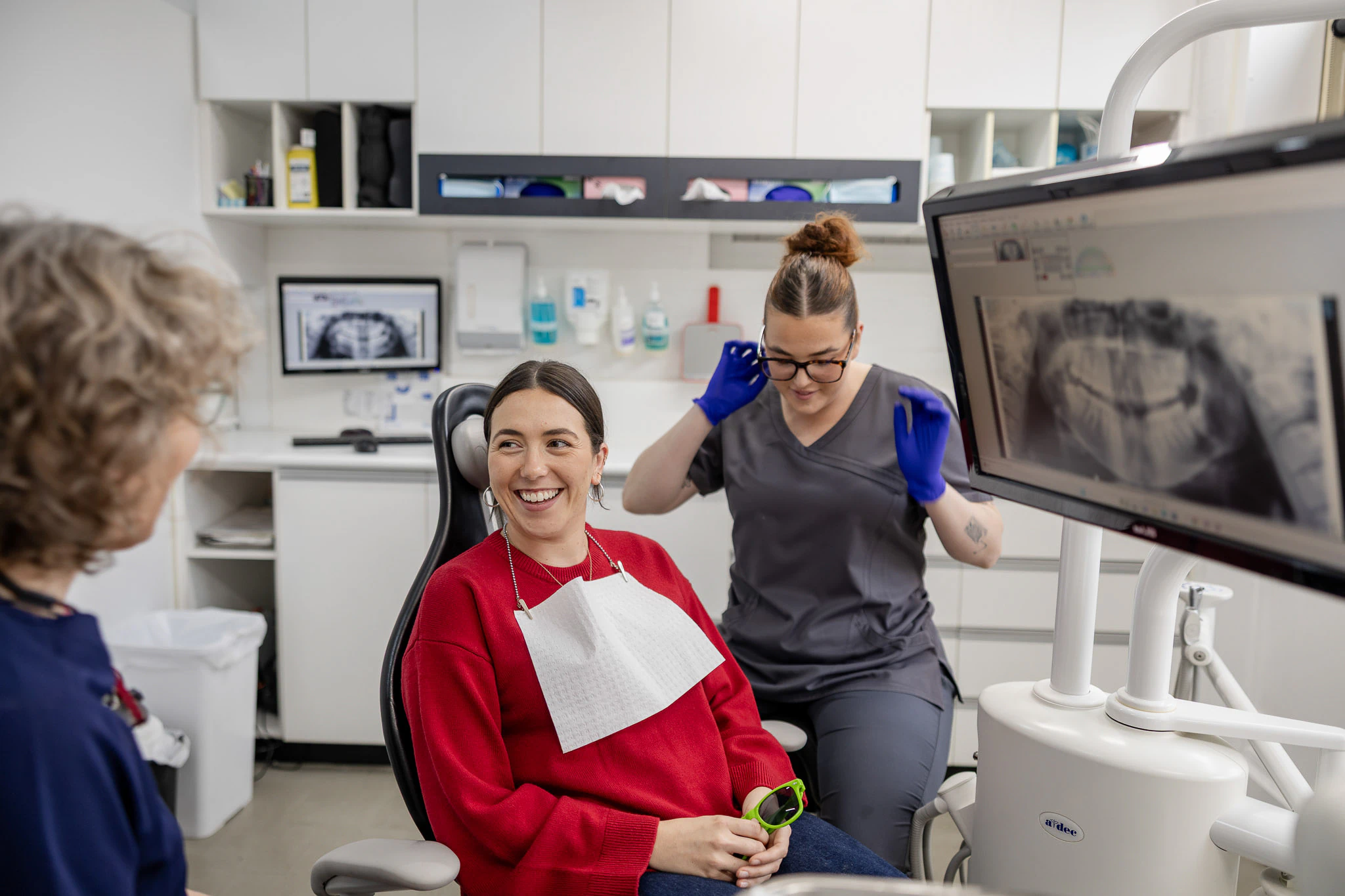 Clinician showing a patient their x-ray on screen