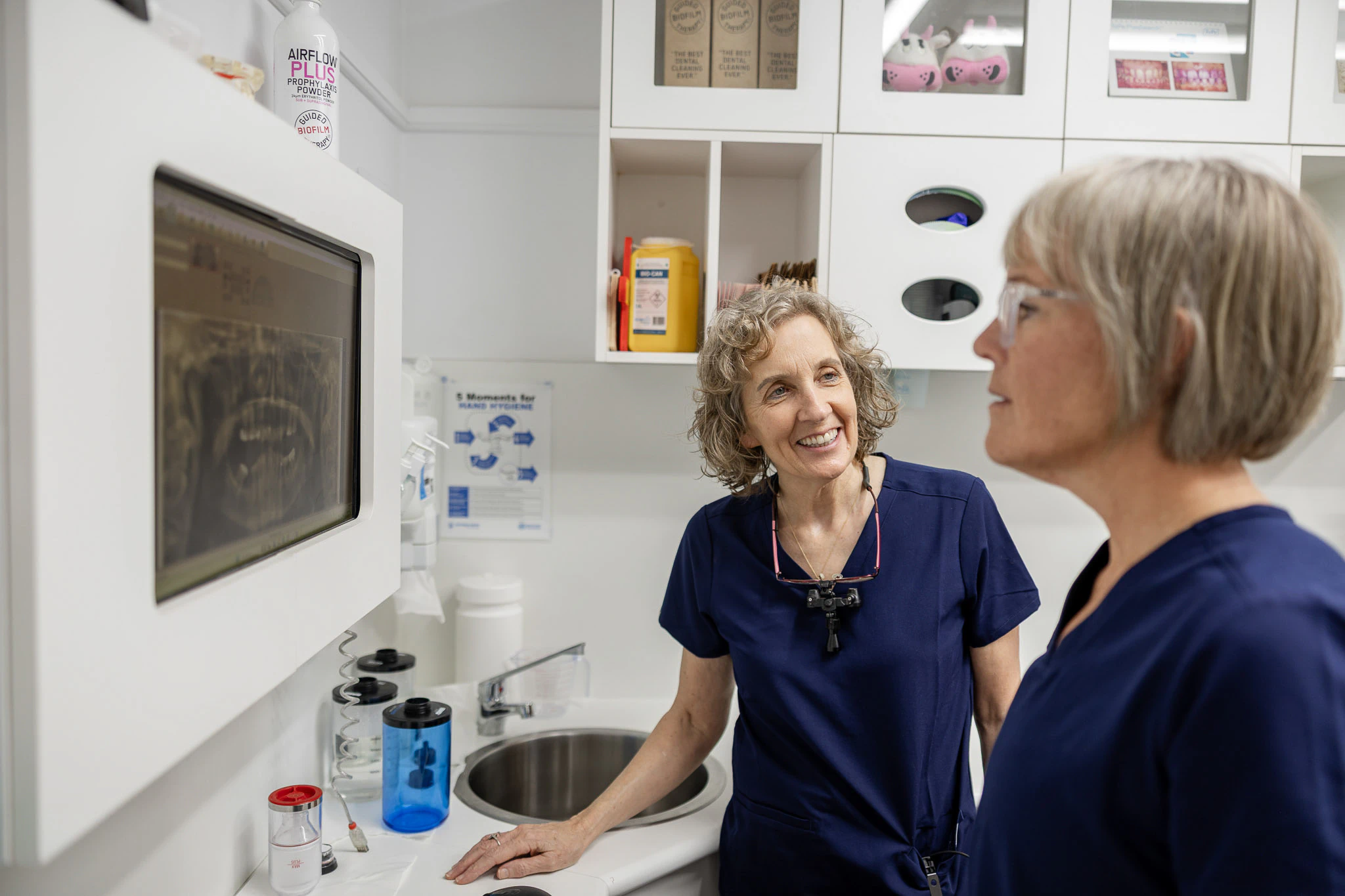 Two clinicians talking in the practice