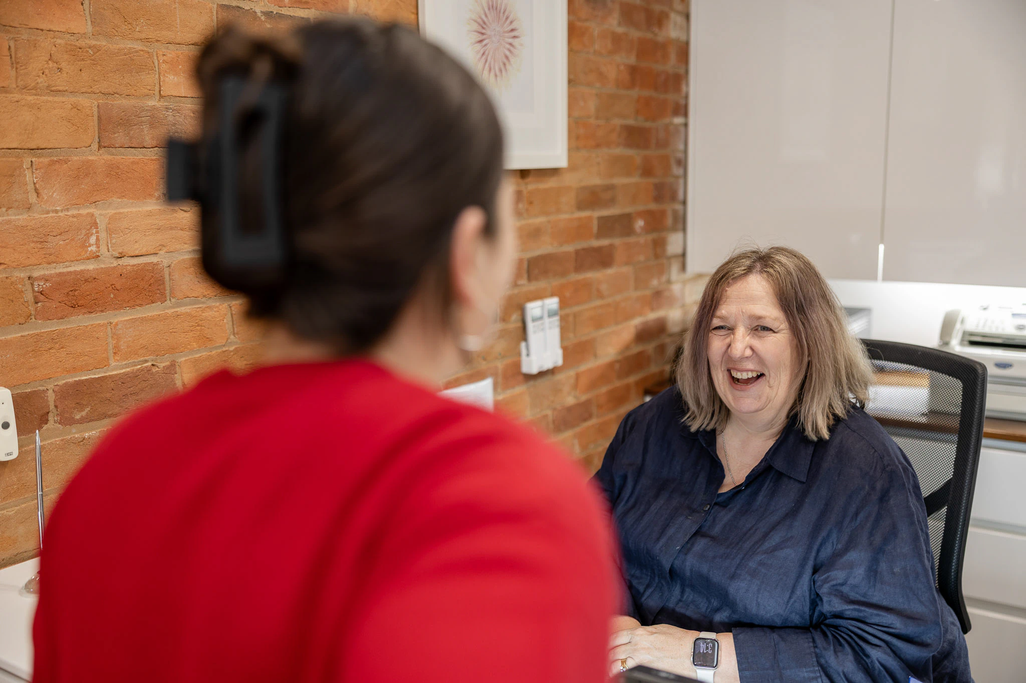 Patient talking with a clinician before treatment